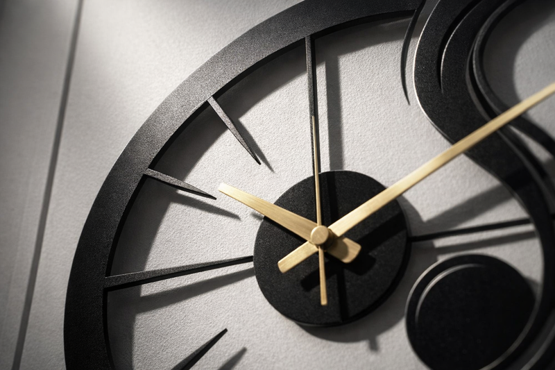 Laser cut metal wall clock close up